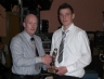 Liam Hardy presents the Christy Hardy Memorial trophy for most improved Footballer to Philip Quinn 